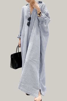 Effortlessly stylish and sophisticated, this striped oversized shirt dress is perfect for the warmer seasons. With a button front, a split neckline, and a high waistline, it exudes elegance and class. The long sleeves and drop shoulder design add a touch of artistry, while the straight hem and non-stretch fabric provide a luxurious finish. Perfect for the fashion-forward and discerning consumer. 95% Polyester, 5% Elastane Please allow 3-5 business days to process and ship. Product Measurements in cm : Size US Bust Length Sleeve Length Cuff S 4 90 130 72 31 M 6 94 131 73 32 L 8/10 100 132 74 33.5 XL 12 106 133 75 35 Chic Oversized Maxi Dress, Casual Oversized Striped Dresses, Elegant Striped Shirt Dress For Vacation, Striped Long Sleeve Maxi Dress For Work, Striped Long Sleeve Maxi Dress For Vacation, Striped Long Sleeve Maxi Dress For Daywear, Oversized Striped Spring Dresses, Striped Long Sleeve Shirt Dress For Daywear, Chic Striped Shirt Dress For Vacation