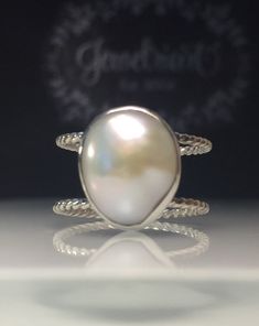 Size 10.5, silver hammered or twisted, Pearl Ring Unique Pearl Ring Handmade Double Band Ring Modern Pearl Ring Free Shipping in the US by Jewelriart on Etsy https://www.etsy.com/listing/626053700/pearl-ring-unique-pearl-ring-handmade Oval Jewelry With A Modern Twist For Weddings, Modern Twist Oval Wedding Jewelry, Sterling Silver Double Band Ring For Wedding, Sterling Silver Double Band Wedding Rings, Wedding Rings With Double Band And Modern Twist, Modern Twist Double Band Wedding Rings, Modern Twist Wedding Rings With Double Band, White Modern Twist Ring Jewelry, Modern Handmade Stackable Rings With Open Band