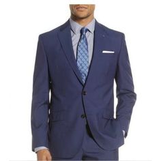 Jacket Has Four-Button Cuffs; Chest Pocket With Pocket Square; Front Flap Pockets; Side Vents Blue Blazer With Button Cuffs For Office, Formal Blue Outerwear With Button Cuffs, Semi-formal Blue Blazer With Button Cuffs, Blue Long Sleeve Suit With Buttons, Classic Royal Blue Blazer, Blue Notch Lapel Sport Coat With Button Closure, Classic Tailored Royal Blue Blazer, Blue Blazer With Button Cuffs And Notch Lapel, Blue Notch Lapel Blazer With Button Cuffs