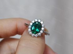 Classic royal style oval Emerald ring, made with 925 sterling silver, plated with white gold, perfect as promise ring, birthday or anniversary gift, etc.Main Stone: 7*9 mm lab created Emerald Side Stone: CZCS022 Silver Oval Emerald Ring For Proposal, Oval Silver Emerald Ring For Proposal, Silver Oval Emerald Ring With Halo, Oval Emerald Ring, Lab Created Emerald, Silver Anniversary, Ruby Engagement Ring, Royal Style, Birthday Ring