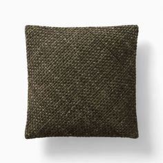 a brown pillow with a black pattern on it