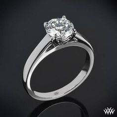 a diamond ring on a black background