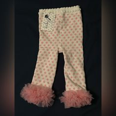 12-18 Month Pink And White Polka Dot Baby Leggings With Pink Ruffle Trim Around Ankles. New With Tags. 78% Cotton 2% Spandex 20% Polyester. Pink Ruffled Bottoms For Playwear, First Birthday Fitted Sets With Ruffles, Playful Stretch Ruffle Bottoms, Playful Stretch Bottoms With Ruffles, Cute Ruffled Bottoms For Playtime, Cute Ruffled Bottoms For Playwear, Spring Ruffled Bottoms For Playtime, Cute Fitted Bottoms For Playwear, Spring Playtime Ruffled Bottoms