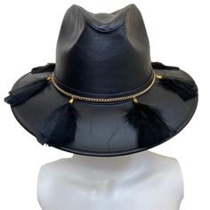 Mexican Handcrafted Leather Fedora Hat | El Cuervo Black A COMPLETE head-turner! Unique/genuine Nubuck Leather ( is top-grain cattle leather that has been sanded or buffed on the grain side, or outside, to give a slight nap of short protein fibers, producing a velvet-like surface) hat on this Men & Women’s Mexican artisan fedora-form in Elegant Black color with genuine leather details around crown, decorative black goose feathers & Gold platted sophisticated accessory ﻿to finish this cus Mexican Sombrero Hat, Fedora Hat Outfits, Modern Hat, Artisan Decor, Mexican Fashion, Modern Mexican, Straw Fedora Hat, Artisan Fashion, Women Hats