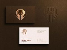 the business card is designed to look like it has an intricate design and gold foil