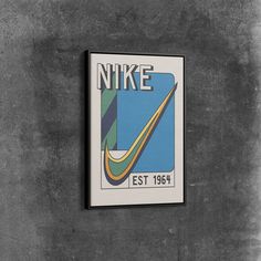 a black and white photo of a nike logo on a wall with the words est1994 below it