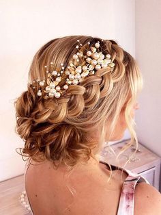 a woman wearing a hair comb with pearls on it's head and in the back