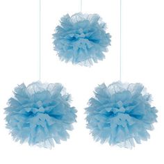 three blue pom poms hanging from strings