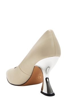 A sculptural metallic heel creates an artful aesthetic on a pointy-toe pump fitted with a cushioned footbed for lasting comfort. 3 1/2" heel Memory foam cushioning Synthetic upper and lining/rubber and synthetic sole Imported Modern Wrapped Heel Closed Toe Heels, Modern Closed Toe Heels With Wrapped Heel, Modern Heels With Sculpted Heel And Almond Toe, Modern Closed Toe Heels With Sculpted Heel, Modern Heels With Wrapped Heel And Almond Toe, Modern Almond Toe Heels With Wrapped Heel, Modern High Heel Court Shoes With Padded Heel, Modern Kitten Heels With Sculpted Heel For Work, Modern Evening Kitten Heels With Round Toe