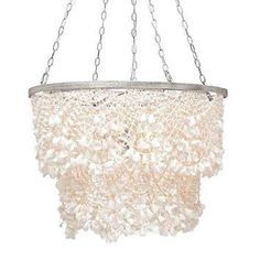 a white chandelier hanging from a chain