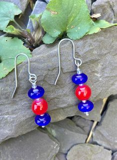 Pretty drop earrings made with three vivid red and blue glass beads with tiny crystal seed beads and high quality surgical steel wires. Total length is approx 4cm These come with a velvet pouch for protection Velvet Pouch, Blue Beads, Blue Glass, Halloween Shopping, Seed Beads, Jewelry Earrings Dangle, Red And Blue, Etsy Earrings, Glass Beads