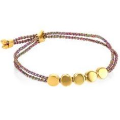 a bracelet with three beads and two gold discs on the end of each bead