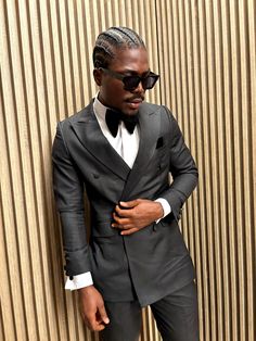 Introducing our custom-tailored, sleek black tuxedo suit, exclusively designed to turn heads at any formal event. Crafted with precision and luxury in mind, this suit blends timeless elegance with modern sophistication. Its clean lines and perfect fit make it an essential piece for the fashion-forward gentleman. Please note that this suit is strictly custom-made, shipping directly from Ghana. To ensure you receive the perfect fit, accurate measurements are required from the customer before we proceed with tailoring. Make this suit uniquely yours by providing your measurements, and let us create a masterpiece tailored to your body. Classic Black Pantsuit For Semi-formal Occasions, Black Double Breasted Suit For Party, Tailored Black Suit For Party, Black Double Breasted Suit For Party With Suit Collar, Black Tailored Party Suit, Black Double-breasted Suit With Suit Collar For Party, Elegant Black Double Breasted Suit With Notch Lapel, Fitted Three-piece Suit With Long Sleeves For Formal Occasions, Luxury Fitted Pantsuit For Formal Occasions