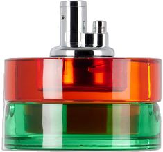 an orange, green and red container with two silver objects on it's sides