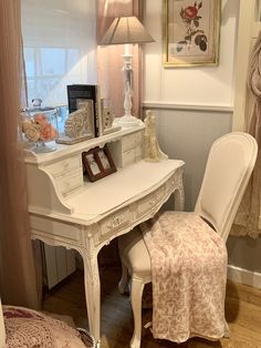 a white desk and chair in a room