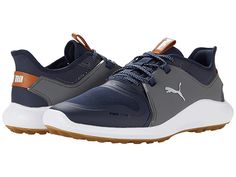 PUMA Golf Ignite Fasten8 - Men's Shoes : Navy Blazer/Puma Silver/Quiet Shade : Stay active in style and comfort with PUMA Golf Ignite Fasten8 lace-up sneakers. Textile and synthetic upper. Round-toe silhouette. Textile lining and insole. Synthetic outsole. Imported. Measurements: Weight: 14 oz Product measurements were taken using size 9, width D - Medium. Please note that measurements may vary by size. Weight of footwear is based on a single item, not a pair. Casual Golf Shoes With Boost Midsole, Functional Low-top Golf Shoes With White Sole, Athleisure Low-top Golf Shoes With Boost Midsole, Breathable Low-top Golf Shoes, Sporty Lace-up Golf Shoes For Light Sports, Sporty High-top Golf Shoes, Sporty Lace-up Golf Shoes, Casual Breathable Golf Shoes, Casual Low-top Golf Shoes