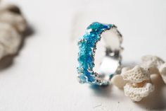 Beautiful ring Wave will bring you back to the sea! This ring is unique! Using hot enamel technique every item receives his own unique texture! https://www.etsy.com/listing/559371911/ - Wide wave ring (10 mm) Details: Width: 5mm Thickness: 1.2 mm Materials: sterling silver 925, hot vitreous enamel These rings in gold: https://www.etsy.com/listing/932462309/ - Gold blue wave https://www.etsy.com/listing/932465221/ - Gold green wave Please provide me size of the ring during the order, thank you! T Ocean-inspired Blue Ring For Gift, Ocean-inspired Blue Ring For Gifts, Ocean-inspired Promise Ring, Ocean-inspired Blue Rings As Gifts, Ocean-inspired Blue Jewelry For Anniversary, Blue Ocean-inspired Jewelry For Anniversary, Ocean-inspired Sterling Silver Jewelry For Wedding, Ocean-inspired Sterling Silver Jewelry For Weddings, Ocean-inspired Round Ring For Anniversary