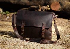 his is a leather satchel from The Handmade Store that is made from genuine leather. It is a professional looking bag that is great for carrying laptops and notebooks. With a flap closure, and an adjustable padded shoulder strap, you can carry this bag over your shoulder or wear it cross-body to keep your hands free. #leather #satchel #bag Vintage Brown Leather Office Bag, Brown Leather-backed Satchel For Business Trips, Brown Smooth Grain Shoulder Bag For Business Trips, Brown Soft Leather Shoulder Camera Bag, Brown Oiled Leather Shoulder Satchel, Brown Soft Leather Camera Bag For Daily Use, Daily Use Brown Soft Leather Camera Bag, Brown Oiled Leather Bag With Smooth Grain, Brown Leather Satchel Camera Bag