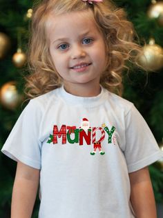 Custom Christmas T-shirt for Girls, Personalized Christmas Name Shirt, Fun Alphabet Custom Name Christmas Shirt, Kids Personalized Christmas Shirt So cute for keeping the kids cute at Christmas! Set them apart with a soft t-shirt customized with their name in this fun Christmas Alphabet. Shirts are classic white, short sleeve. Sizes from Baby to Youth Classic white, short sleeve shirt Sublimated Design Adorable gift for kids to wear on Christmas morning or at school parties! Cute White Christmas T-shirt, Cute Christmas T-shirt With Letter Print, Personalized Playful T-shirt As Gift, Playful Personalized T-shirt As Gift, Playful Personalized T-shirt For Gift, Cute Letter Print T-shirt For Holiday, White Tops For Christmas Birthday, Personalized Christmas Shirts, Fun Alphabet