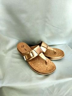 Flat flip-flop sandals with hook and adjustable loop closure. Brand: CLARK - Cloudsteppers Super soft cushion. Best quality faux leather. Color: Gold Size: US 9.1/2 Excellent condition. Slightly used. Thank you for visiting my store. You can also visit my MargaretJewelryShop or http://jewelryandclothing.net/ Adjustable T-strap Sandals With Ortholite Insole, Adjustable Cushioned T-strap Sandals, T-strap Toe Loop Sandals With Cushioned Footbed, Toe Loop T-strap Sandals With Cushioned Footbed, Adjustable Synthetic T-strap Sandals With Textured Footbed, Adjustable Open Toe Flip Flops With Buckle Closure, Adjustable Textured T-strap Sandals In Synthetic, Adjustable Buckle Closure Open Toe Flip Flops, Adjustable Synthetic Flip Flops With Buckle Closure