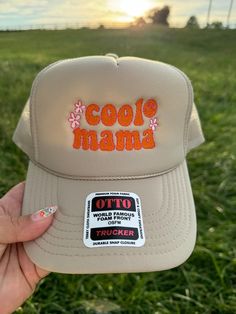 Welcome to our Etsy shop and check out our website www.ShopRusticHills.com! Elevate your style with our custom embroidered Otto brand hat, perfect for all the cool mamas out there! This tan hat features a vibrant design with "Cool Mama" embroidered in bold orange and hot pink threads. A charming smiley face and a few delicate flowers add a playful touch, making this hat a fun and stylish accessory for any casual outfit. Crafted with the highest quality, this hat is comfortable, durable, and sure to become a favorite in your wardrobe. We are not responsible for lost nor stolen packages once handed off to UPS or USPS, but we will help. They will have to get up with the carrier if a problem comes up. Embroidered Hats Baseball Caps, Orange And Hot Pink, Hat Bar, Hats Baseball Caps, Patch Hats, Tan Hat, Hats Baseball, Embroidered Hat, Happy Dance