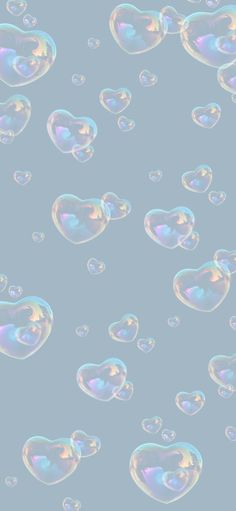 soap bubbles floating in the air on a blue background with white and pink colors,