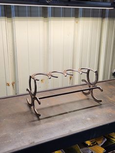 a pair of glasses sitting on top of a metal bench