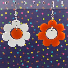 "Everything is coming up daisies! -Lightweight acrylic -Gold plated / stainless steel french hooks -Measurements: 1.6\" x 1.6\" Designed and handcrafted in Chattanooga, TN Actual colors may vary slightly due to differences in monitors and browsers. Contact us if you have any questions!" Retro White Dangle Earrings, Trendy White Plastic Earrings, Trendy White Earrings, Handmade White Plastic Earrings, White Plastic Summer Jewelry, White Plastic Jewelry For Summer, Retro White Dangle Jewelry, Retro White Earrings For Gift, White Nickel Free Flower Earrings For Spring