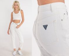 "Vintage 90s jeans by Guess in white denim with a mid rise waist and a slim mom fit. Please see measurements and condition below. Every garment we sell is authentic vintage! You will receive the exact item photographed. Condition: Very good vintage with light general wear. Has one faint stain on the back, See photos Best fits women's: Labelled size 26 but fits 2XS due to mid rise Tag: Guess Material:  Cotton MEASUREMENTS Taken from seam to seam while the garment is lying flat. Double the armpit, Casual White Tapered Leg Cropped Jeans, White Denim Bottoms In 90s Style, 90s White Denim Bottoms, Vintage High Rise White Bottoms, Vintage High Rise White Jeans, Vintage High-rise White Jeans, Vintage White Mid-rise Bottoms, White Tapered Leg Cropped Jeans, White Vintage Mid-rise Bottoms