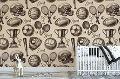 a baby's room with sports themed wallpaper