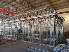 the inside of a building that is being constructed with metal bars and steel framework