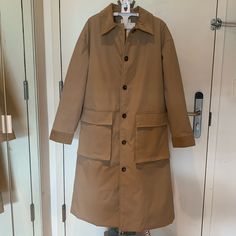 This Piece Features A Cord Collar, Button-Front Closure, And Two Front Pockets. Lined Interior. Warm Padding - Perfect For Fall And Winter. Size: S Color: Beige / Camel Not Zara, Brand Used For Visibility Only. Khaki Outerwear With Lapel Collar And Button Cuffs, Utility Outerwear With Lapel Collar And Button Closure, Beige Stand Collar Outerwear With Buttons, Collared Utility Outerwear With Button Closure, Khaki Long Coat With Button Cuffs, Khaki Long Coat With Buttons, Winter Utility Outerwear With Button Cuffs, Beige Collared Outerwear With Button Closure, Collared Khaki Outerwear For Work