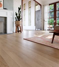 a living room with hardwood floors and white walls