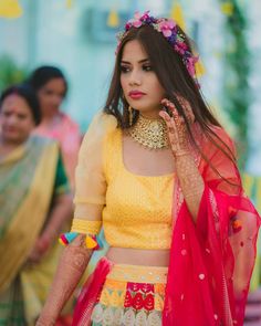 a woman wearing a yellow and red outfit