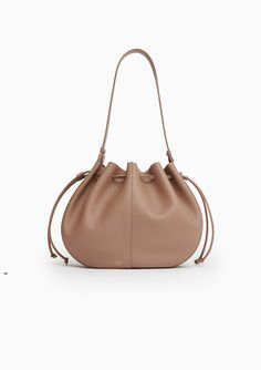 Dimensions: 7.8 x 9.8 x 3.5 inShoulder Bags Crafted from their soft Italian tumbled leather, Mansur Gavriel's Flores Bag is inspired by blooming florals. A two-sided drawstring closure creates a petal effect and provides easy access to a spacious suede interior. Composition: 100% Italian Soft Calf Leather | Lining: 100% Italian Calf Suede Handle drop: 10.2" Total height: 15.3" Made in Italy Spring Leather Bucket Hobo Bag, Elegant Spring Hobo Bag In Soft Leather, Elegant Spring Soft Leather Hobo Bag, Spring Soft Leather Hobo Bag, Elegant Leather Hobo Bag For Spring, Leather Drawstring Bags, Vintage Wedding Gifts, Louise Roe, Boy Shorts Panties