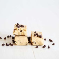 three pieces of chocolate chip cookie dough sitting on top of each other