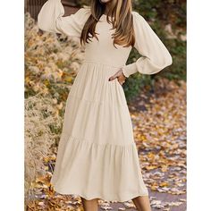 Beige Pleated Long Sleeve Swing Dress Cream Dresses For Fall Day Out, Cream Dresses For Day Out In Fall, Cream Dress For Day Out In Fall, Neutral Long Sleeve Winter Dress, Neutral Fall Dress For Day Out, Neutral Fall Day Out Dress, Beige Long Sleeve Dress For Day Out, Long Sleeve Solid Color Midi Dress For Brunch, Beige Solid Color Midi Dress For Fall