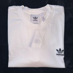 Brand New White Adidas T Shirt With Classic Adidas Logo On Front. Never Worn. Smoke Free Home Adidas Cotton T-shirt For Streetwear, White Sporty T-shirt With Branding, White Adidas Sporty T-shirt, Adidas White Sporty T-shirt, White Crew Neck Graphic Tee, Basic White Shirt With Graphic Print, White Basic Shirt With Graphic Print, White Short Sleeve Tops With Logo Print, White Short Sleeve Top With Logo Print