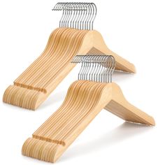 two wooden hangers with metal clips on them