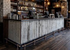 an old bar with lots of bottles on it