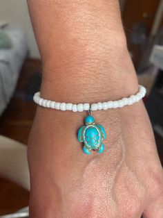 Sea Turtle Stretch Bracelet, Turquoise Bead Charm, with white, Womens Ocean Beach jewelry, Turtle lover gift, stretchy, beachwear  Bracelets made 7.5 inches long One size fits most Made with durable clear stretchy cord.  If you need a specific length, please include a buyers note with your order so I can accommodate that request. Spiritual Stretch Bracelet For Beach, White Round Bead Bracelets For Vacation, White Beaded Bracelets For Vacation, White Round Beads Bracelets For Vacation, White Round Beaded Bracelets For Vacation, White Round Beads Bracelet For Vacation, Handmade White Stretch Bracelet For Vacation, Adjustable Spiritual Stretch Bracelet For Beach, Spiritual White Stretch Bracelet For Beach