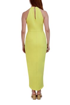 A sleek and sophisticated piece designed for garden themed galas or attending special milestone festivities outdoors, this beautiful faux wrap halter dress reaching right above the ankles, is styled with two back button closures with a concealed zip and keyhole display, a twisted halter neckline, and a faux wrap tulip hem skirt. Fitted Halter Neck Midi Dress With Back Zipper, Fitted Maxi Length Halter Dress For Garden Party, Fitted Halter Maxi Dress For Garden Party, Chic Halter Neck Midi Dress With Back Zipper, Halter Neck Dress With Back Zipper For Spring, Elegant Fitted Halter Dress With Back Zipper, Spring Halter Dress With Back Zipper, Spring Fitted Halter Dress With Back Zipper, Fitted Spring Halter Dress With Back Zipper