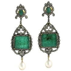 These hand carved earrings are meticulously crafted in 18-karat gold and sterling silver. It is set in 49.65 carats Emerald, 12.9 carats pearl and 3.91 carats of glimmering diamonds. FOLLOW MEGHNA JEWELS storefront to view the latest collection & exclusive pieces. Meghna Jewels is proudly rated as a Top Seller on 1stDibs with 5 star customer reviews. All items manufactured by us are handmade and can be customized or redesigned. Composition Size-82X28 MM Total Weight-34.142 Gold Weight(Gms)-1.81 Luxury Green Carved Jewelry, Medieval Jewelry Emerald, Luxury Meenakari Emerald Jewelry, Carved Emerald, Gold Silver Jewelry, Pearl Dangle Earrings, Pearl And Diamond Earrings, Pearl Earrings Dangle, Mens Jewelry Bracelet