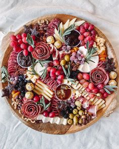 a wooden platter filled with different types of food