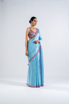 Satin chiffon mirror work border saree paired with sequins embellished blouse.From Vvani Vats Chahak's collection.DELIVERY TIMEPlease allow 8-12 weeks for your outfit to arrive..FABRIC DETAILSBlouse - Georgette, Saree - Satin ChiffonProfessional cleaning only. Traditional Blue Pre-draped Saree With Sequins, Traditional Blue Sequined Pre-draped Saree, Blue Traditional Wear With Sequins, Blue Sequined Traditional Wear With Drape, Traditional Blue Blouse Piece With Sequins, Blue Sequined Saree Traditional Wear, Traditional Blue Sequined Saree, Designer Blue Pre-draped Saree With Mirror Work, Festive Blue Pre-draped Saree With Sequins