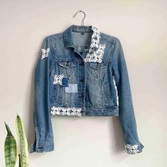 Up-cycled denim jacket with crochet patches, denim patches, embroidery, and white paint splatter. White Cotton Denim Jacket With Patchwork, White Patchwork Cotton Denim Jacket, Casual White Patchwork Denim Jacket, White Denim Patchwork Outerwear, White Embroidered Cotton Denim Jacket, Mending Denim, Crochet Patches, Bleached Denim Jacket, White Paint Splatter