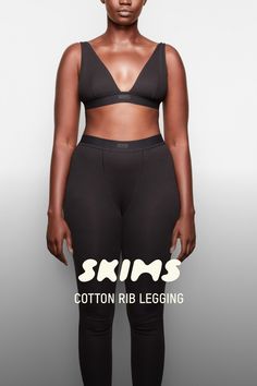 The legging taking over your feed. Made with our iconic ribbed cotton that everyone craves, this breathable style is the cutest, most comfortable legging you’ll ever wear. Features a smooth elastic waist with a SKIMS logo label at the center front and banded cuffs at the hem. Fits true to size. Pair with the Cotton Rib Tank or Plunge Bralette for the matching set. | SKIMS Legging | Black | 2XS | Cotton Rib Tight Ribbed Leggings For Loungewear, Fitted Ribbed Tights For Loungewear, Compressive Leggings With Ribbed Waistband For Loungewear, Tight Leggings For Loungewear, Fitted Ribbed Leggings For Loungewear, Cotton Compression Bottoms For Loungewear, High Stretch Cotton Leggings For Athleisure, High Stretch Cotton Athleisure Leggings, High Stretch Seamless Cotton Activewear