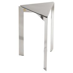 a metal table with a triangle shaped design on it's top and bottom, against a white background