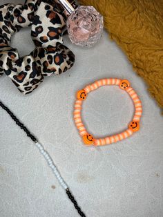 Creamsicle themed bracelet. clay beaded bracelet perfect for summer. these are bracelets that I make by hand. Casual Plastic Bracelets With Letter Beads, Casual Letter Beads Plastic Bracelets, Cute Beaded Plastic Stretch Bracelet, Trendy Handmade Plastic Bracelets, Cute Adjustable Polymer Clay Bracelets, Fun Beaded Heishi Beads Bracelets, Adjustable Cute Polymer Clay Bracelets, Trendy Plastic Beaded Friendship Bracelets, Trendy Colorful Beaded Polymer Clay Bracelets