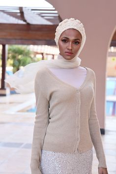 Complete your look with this stunning cream turban veil. Our Mystery in Cream Veil presents this magnificently embroidered turban to frame your face for a distinctive look. The one-piece turban veil is made especially for a simple yet classy fit that you can do yourself. The 58” long veil has a light cream shade to brighten up your dress.Whether it’s your wedding or engagement party, this turban veil will surprisingly shine up your special day and wow your guests.The turban's embroidery is based Luxury Wedding Turban For Women, Elegant White Hijab, Traditional White Headscarf, Elegant White Headscarf For Wedding, Elegant White Wedding Headscarf, Elegant Fitted White Turban, Elegant White Fitted Turban, Fitted Headscarf For Wedding, White Headscarf For Wedding